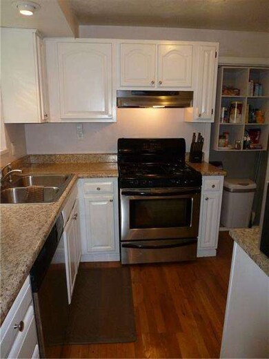 Kitchen with newer counter tops and stainless stee