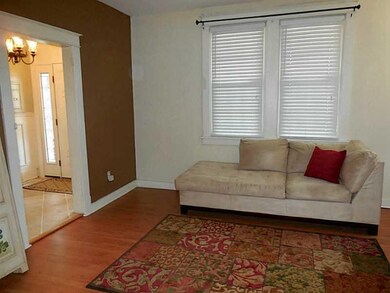Living Room. View of the entry hall from the forma