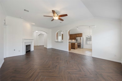 This bright, open-concept living area features ele