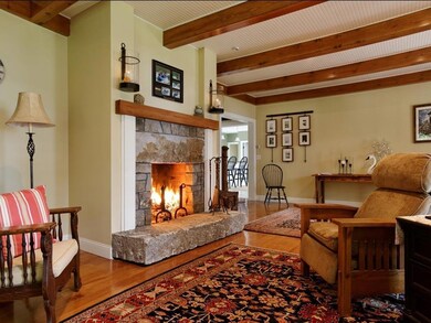 Living room has granite fireplace,...
