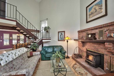 The formal living room boasts a dramatic two-story