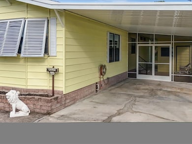 HOME HAS A COVERED SIDE ENTRANCE.