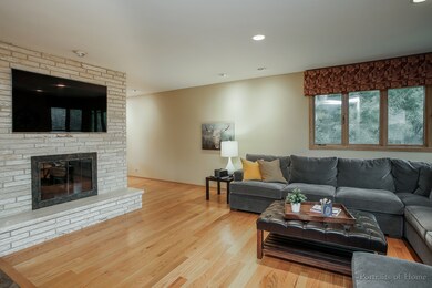 2 sided fireplace that divides Living Room from Fa