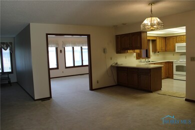 dining room open to living room and entrance to su