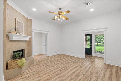 Unfurnished living room with ceiling fan, light wo