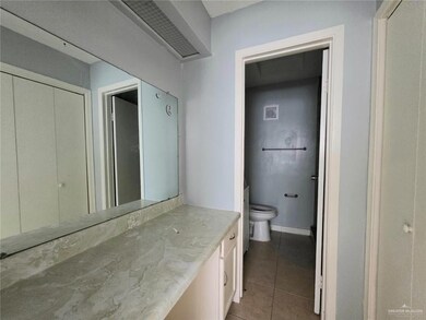 Bathroom with vanity and tile patterned flooring