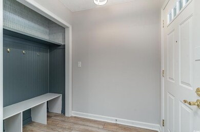 Mudroom featuring light wood-style floors