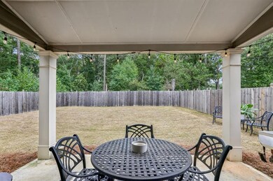 Rear Covered Patio Overlooking A Fully Fenced Back