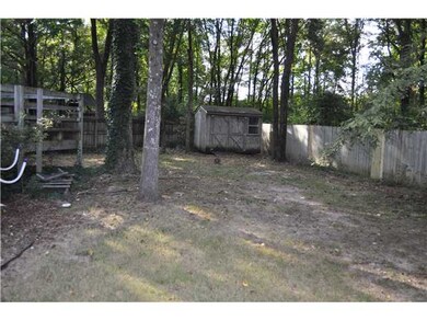 Another view of the back yard shows the storage sh