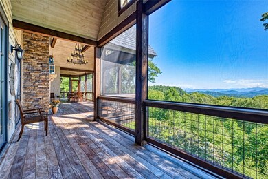 Screened porch with floor to ceiling stone firepla