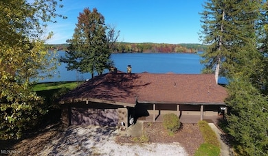 One of the best lots on Atwood Lake! Two car attached garage for cars or nautical toys.