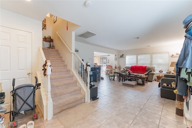 Stairs featuring tile patterned floors