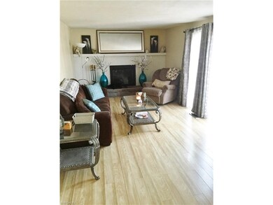 Family room with fireplace and sliders to the deck