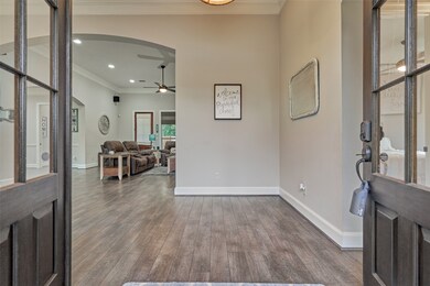 Beautiful double wood and glass entry doors welcome your guest to the large foyer.