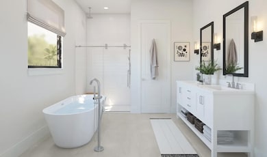 Primary bath with freestanding tub and glass shower enclosure