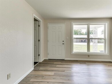 Entryway with hardwood / wood-style flooring and a wealth of natural light