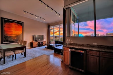 Living room featuring wine cooler, wood finished f