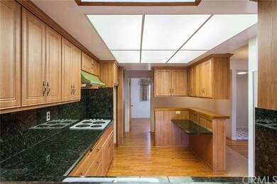 view of kitchen and bar from family room 