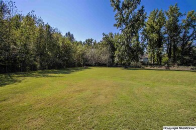 This beautiful large lawn is adjacent to your condo.  Fully maintained by the condo association it's like living next to a park.  It's like living IN a park!  Not far (but far enough) is the large fenced dog park too!