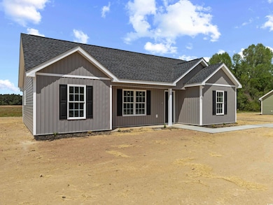 View of front facade featuring roof with shingles