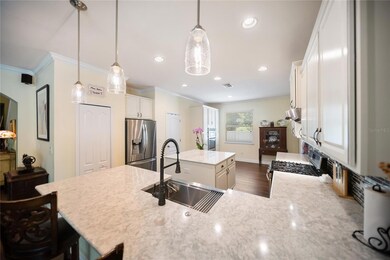 Very spacious Kitchen with custom cabinetry, multiple pantries, stainless-steel appliances, and gas range