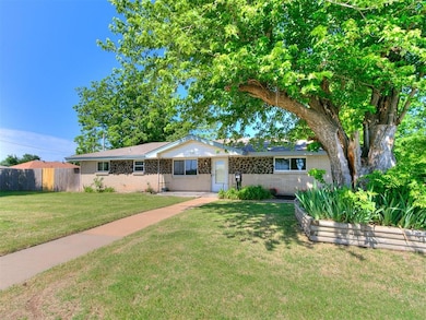 Ranch-style house with brick siding