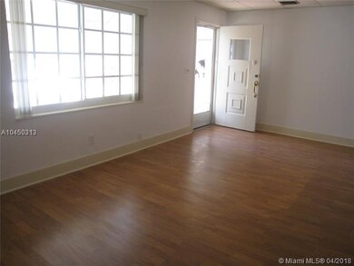 Front entry into the living room; impact glass win