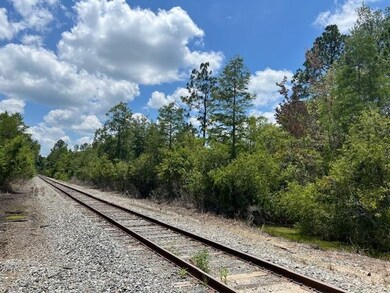 Bordered by a railroad track, this property offers
