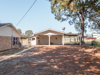 View of front of property with fence, brick siding
