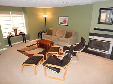 Living Room. A gas fireplace is the focal point of