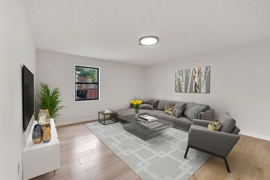 Large living area with new wood flooring