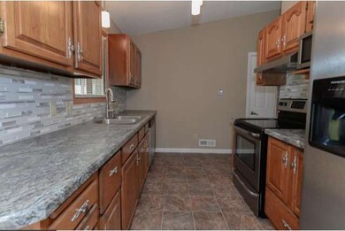 The kitchen features new stainless steel appliance