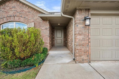 Property entrance featuring brick siding