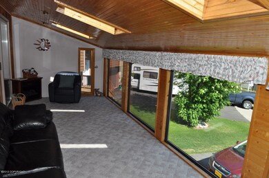 Covered sunroom Above Garage