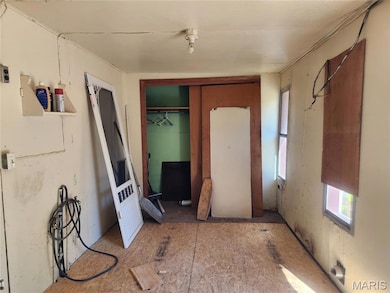 Unfurnished bedroom featuring a closet