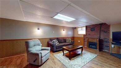Hardwood floored living room featuring a fireplace