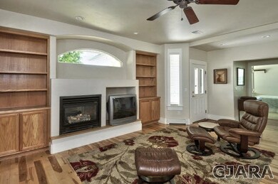 This warm and inviting living room is cooled in su