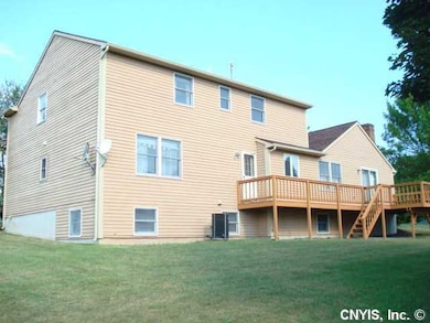 Exterior Back. Full deck with an entrance from the