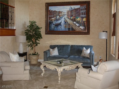 Carpeted living room featuring baseboards