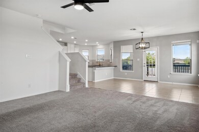 Unfurnished living room featuring tile patterned 