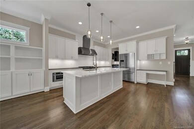 Beautiful kitchen with large island and a lot of c