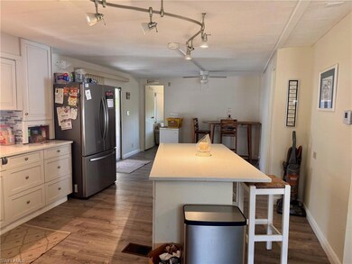 Kitchen with freestanding refrigerator, a breakfas