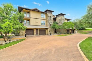 View of front of home featuring stone siding, con