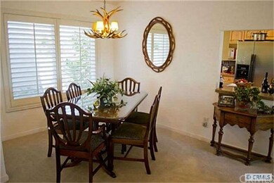 Formal dining room with custom window shutters.