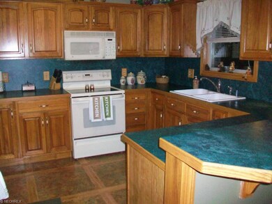 Fully applianced Kitchen with oak cabinets and bre