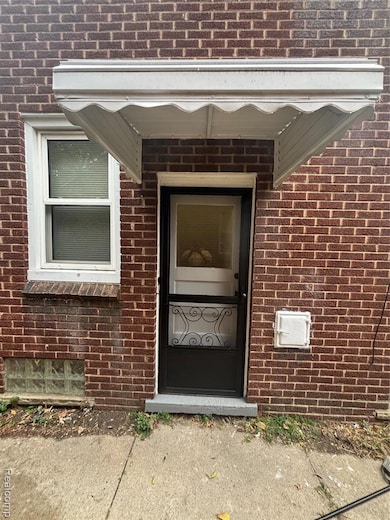 Property entrance with brick siding