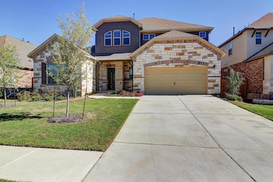 View of front of home featuring driveway, a shing