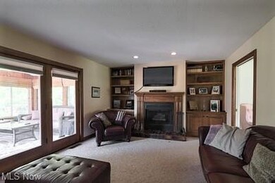 Lovely Family Room has built-ins, wood burning fir