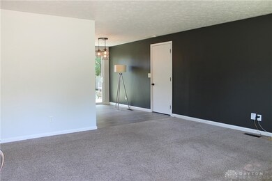 Living Room into Dining Room and Kitchen