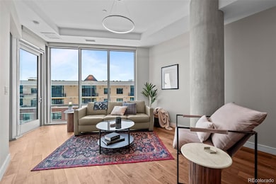 Open floor plan, hardwood flooring, light and bright with floor to ceiling windows